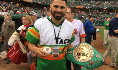 Photo of world boxing champion Jose Ramirez with his title belt