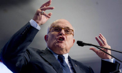 Photo of Rudy Giuliani speaking and making a point with both hands