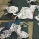 Photo of kids on floor of immigration holding facility in McAllen, Texas