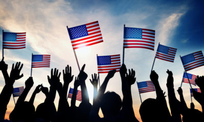 Photo of July 4th revelers holding American flags