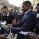 Photo of two French World Cup team members signing autographs