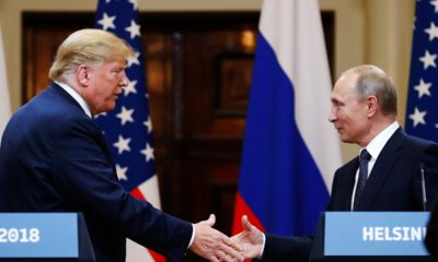 Photo of Trump and Putin shaking hands