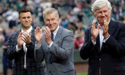 Photo of Seattle Mariners general manager Jerry Dipoto, left, president Kevin Mather, center, and majority owner John Stanton