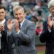 Photo of Seattle Mariners general manager Jerry Dipoto, left, president Kevin Mather, center, and majority owner John Stanton