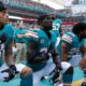 Photo of Miami Dolphins kneeling during the National Anthem before NFL game