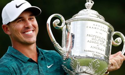 Photo of Brooks Koepka holding the Wanamaker Trophy