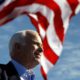 Photo of John McCain in front of an American flag