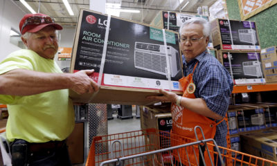 Picture of a man buying a room air conditioner in Seattle.