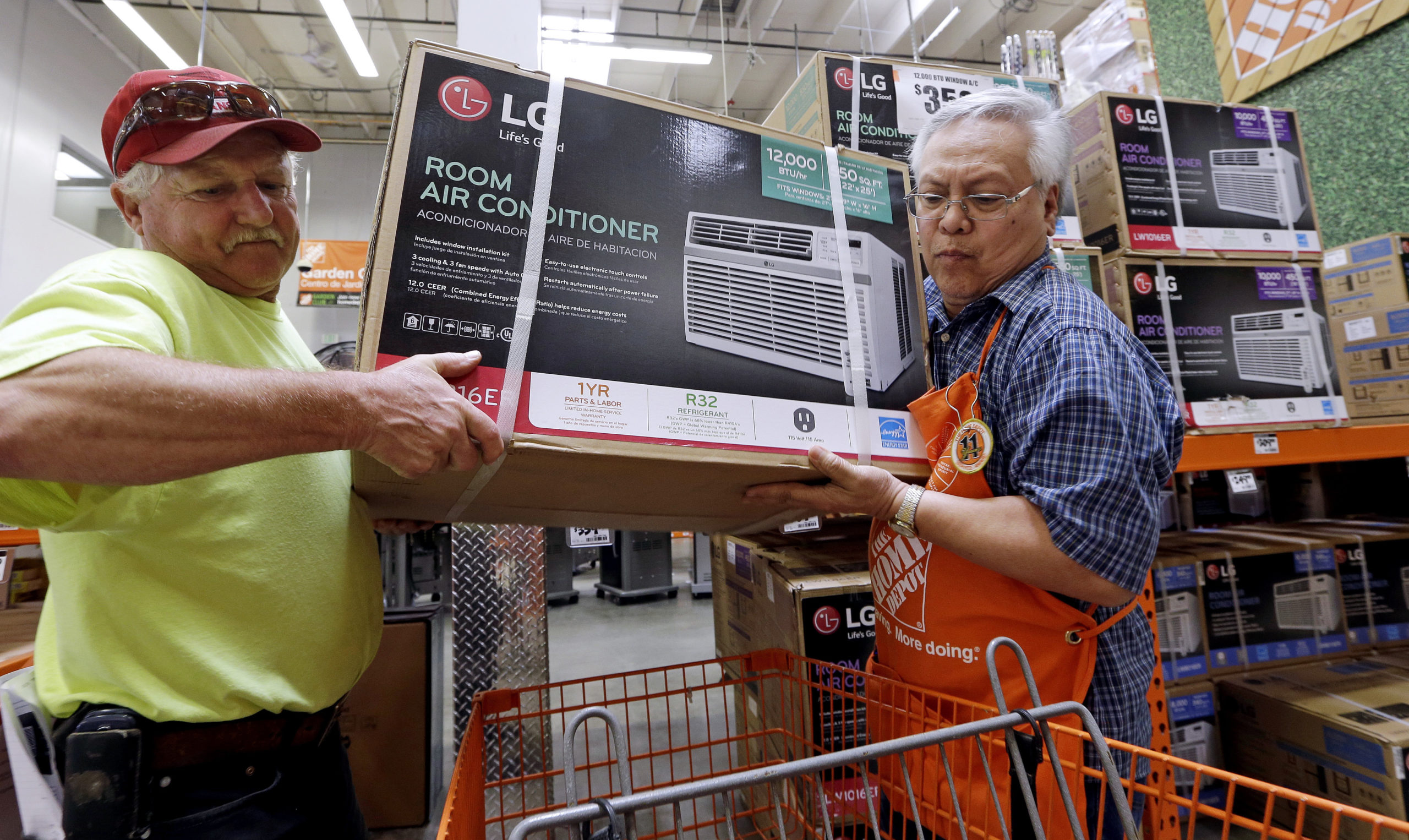 Picture of a man buying a room air conditioner in Seattle.