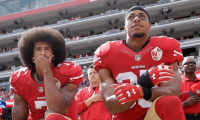 Photo of San Francisco 49ers quarterback Colin Kaepernick, left, and safety Eric Reid