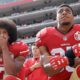 Photo of San Francisco 49ers quarterback Colin Kaepernick, left, and safety Eric Reid