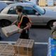 Photo of members of the Civil Air Patrol loading cars with MREs, water and tarps