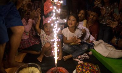 Photo of migrant children celebrating a birthday at a temporary shelter in Mexico