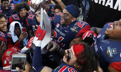 Photo of Fresno State football team celebrating after their win