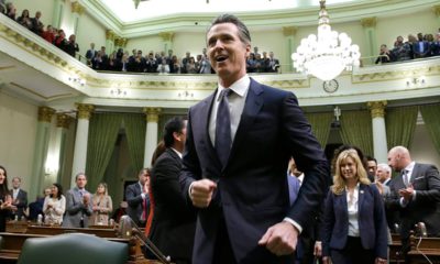 Gov. Gavin Newsom enters the Capitol chamber