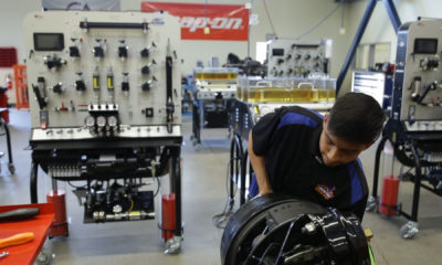 A photo of Duncan Poly student Enoc Lopez working in the school's new heavy maintenance facility