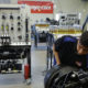 A photo of Duncan Poly student Enoc Lopez working in the school's new heavy maintenance facility