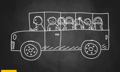 chalkboard drawing of a school bus filled with kids