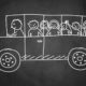 chalkboard drawing of a school bus filled with kids