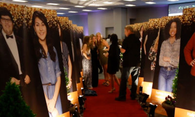 Photos of Clovis Unified Students of Promise on display at scholarship dinner event.