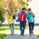 Photo of 3 children walking to school