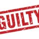 A red and white sign that says Guilty