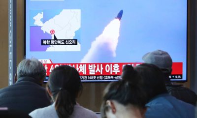 Photo of people watching North Korea's missile launch