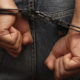 Shutterstock photo of man in handcuffs with back to camera