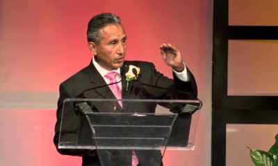 Photo of Henry R. Perea speaking at a podium