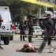 Photo of a bloodied man laying in the street in Mexico