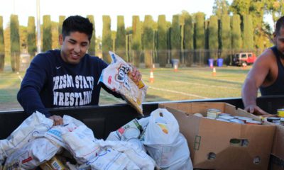 Photo of Fresno State students help out during the 2018 "Feed the Need" food drive for the Student Cupboard