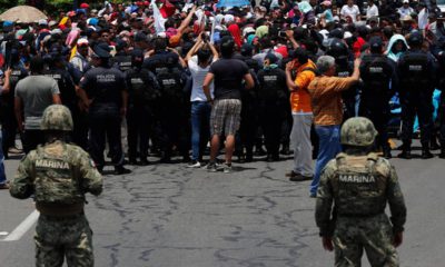 Photo of Mexican authorities stopping a migrant caravan