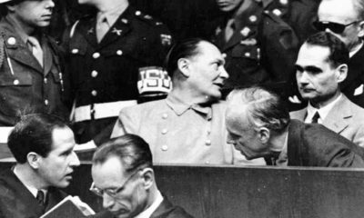 Photo of Nazi German Foreign Minister Joachim von Ribbentrop, right, leans in front of Rudolf Hess, Hitler's deputy