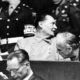 Photo of Nazi German Foreign Minister Joachim von Ribbentrop, right, leans in front of Rudolf Hess, Hitler's deputy