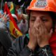 Photo of opponents of Bolivia's Present Evo Morales celebrating after he announced his resignation