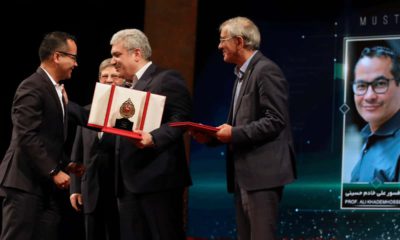 Photo of UCLA professor Ali Khademhosseini receiving an award