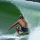 Photo of a man surfing at a wave park in Lemoore, California