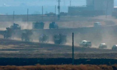 Photo of military vehicles moving in a convoy