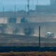 Photo of military vehicles moving in a convoy