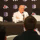 Photo of Jeff Tedford sitting at a table and talking to the media.