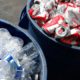 Photo of water bottles and Budweiser cans