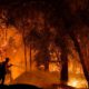 Photo of firefighter battling a wildfire in California