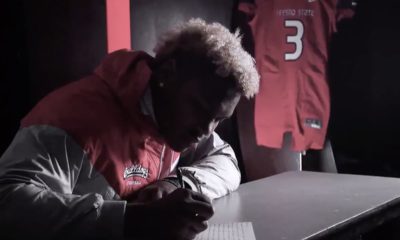 Image from video of Mykal Walker writing a letter to his late father, Michael James Walker