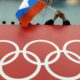 Photo of a Russian skating fan holding the country's flag