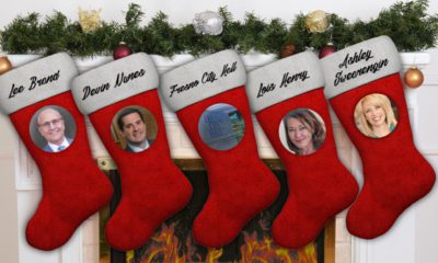 composite image of Christmas stockings and portraits of politicians