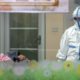 Photo of a doctor with to a patient in an isolation ward at a hospital in Wuhan in central China's Hubei Province