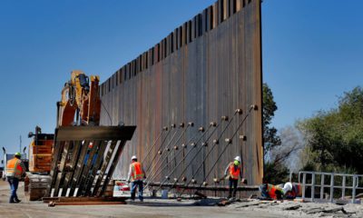 Photo of government contractors working on a section of the Pentagon-funded border wall