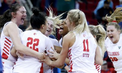 Photo of Fresno State women's basketball team celebrating a victoryta