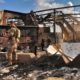 Photo of U.S. soldiers and journalists inspecting the rubble