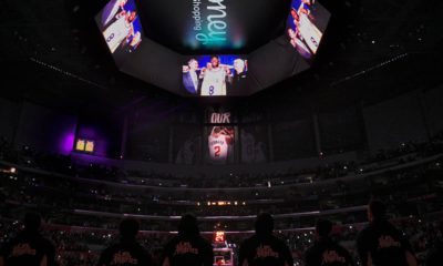 Photo of The Los Angeles Clippers standing for a tribute to Kobe Bryant